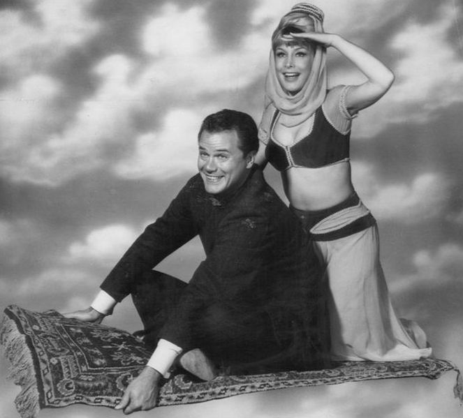 The only way Jeannie could bare or navel-gaze was if she popped in her bottle.  But she could gaze at Tony's and he could navel gaze all he wanted.  Figures.  